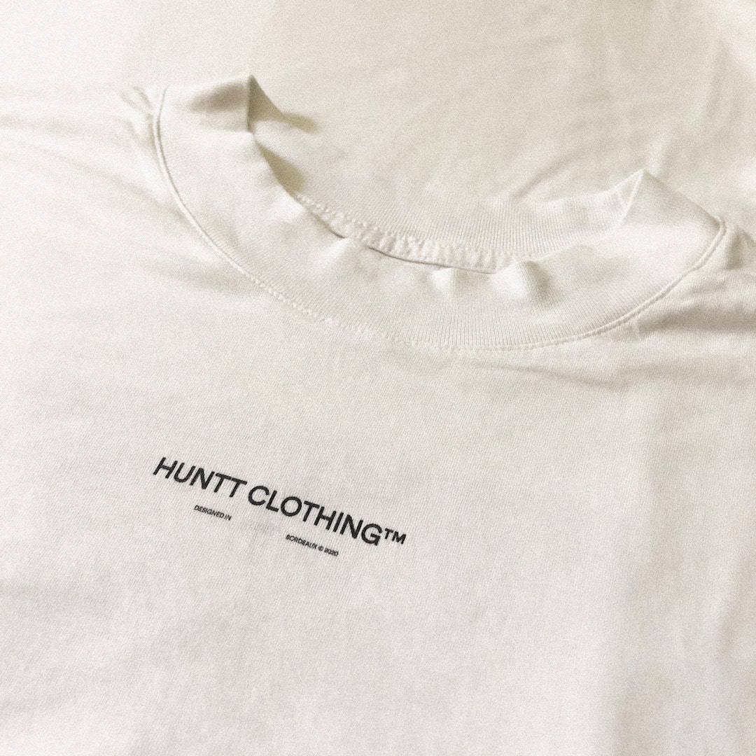 Design details of a white t-shirt from the Sunset collection